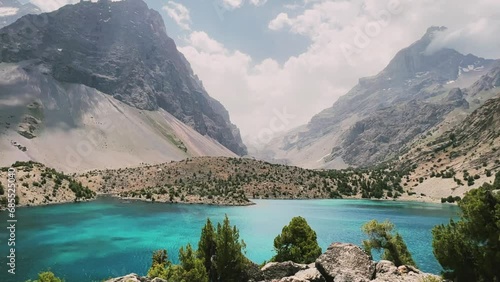 The Alaudin (Chapdara) lakes, lying at an altitude of 2800 m, are considered one of the most beautiful lakes of the Fan Mountains. Turquoise mountain lake. Pamiro-Alai. Tajikistan, Pamir 4K photo