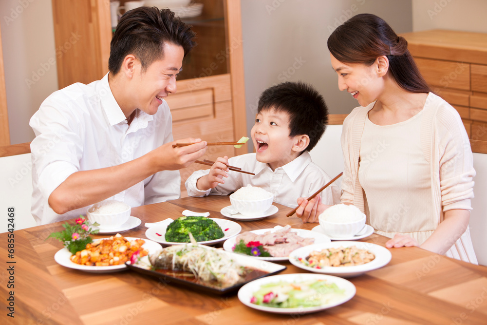 Happy family enjoying meal time Happy family enjoying meal time