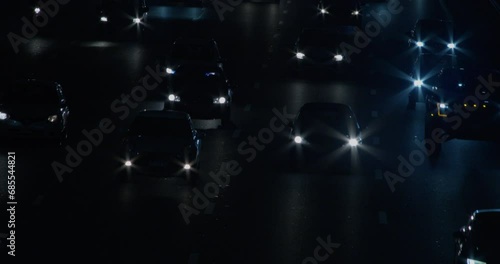 Close-up of cars driving on a cold highway at night photo