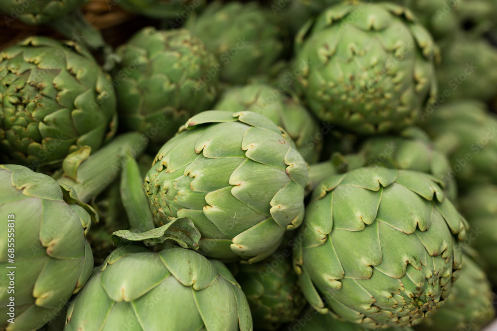 Fresh artichokes on market counter Fresh artichokes on market counter