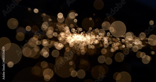 Super slow motion macro of abstract bokeh flying sparks glitter lights isolated on dark background. photo