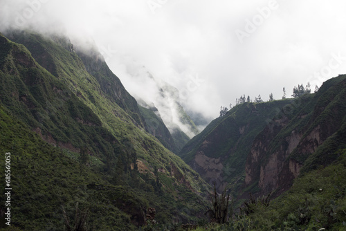 Spectacular and amazing beautiful panorama of the Andes Mountains in the Colca Canyon, Peru. White clouds, wonderful cloudscape. Cliff, blue sky. HDR photo