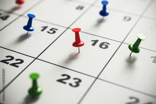 Close-up of a calendar with colorful pins marking important dates. Time management and planning concept. 3D Rendering