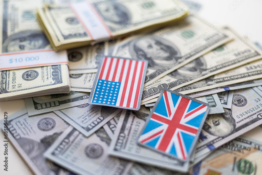 Flag of United Kingdom sticking in a variety of american banknotes.(series) Flag of United Kingdom sticking in a variety of american banknotes.(series)
