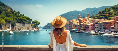 Fotografia Tourist girl enjoying view of picturesque village in Portofino Italy copy space
