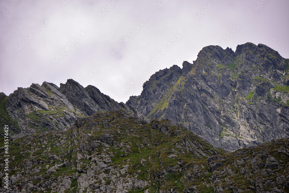 High and rocky mountains in the summer season. Landscape with the wild Carpathians of Romania High and rocky mountains in the summer season. Landscape with the wild Carpathians of Romania