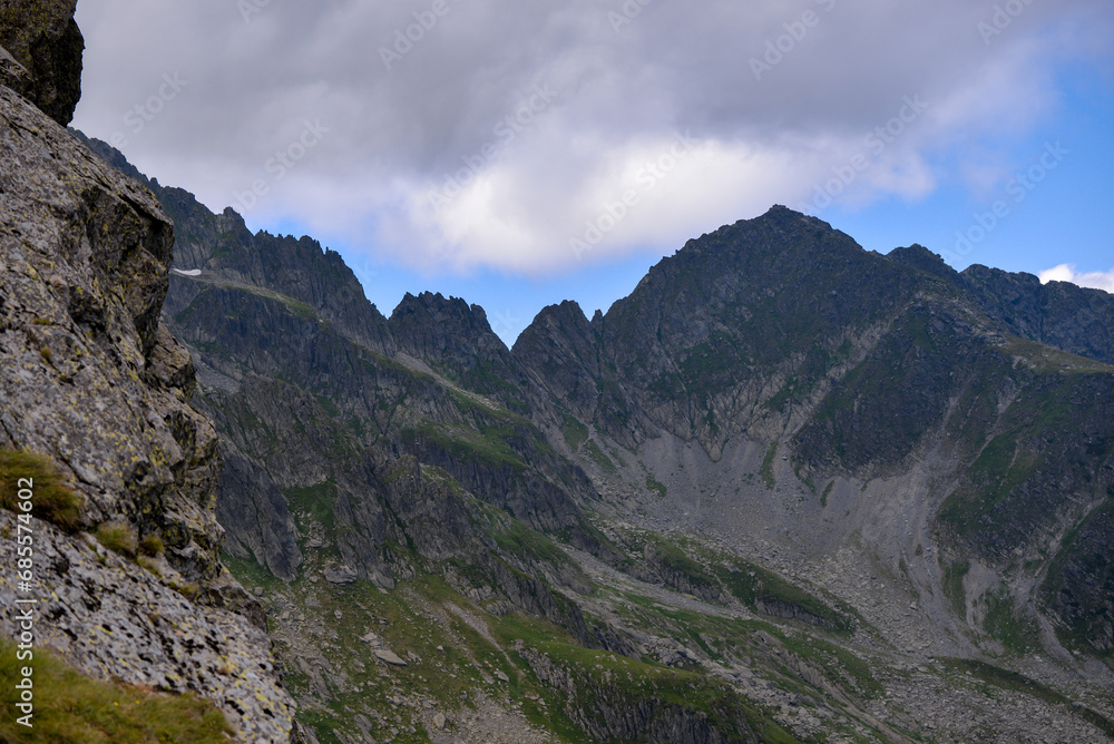 High and rocky mountains in the summer season. Landscape with the wild Carpathians of Romania