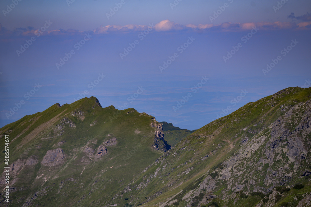 High and rocky mountains in the summer season. Landscape with the wild Carpathians of Romania