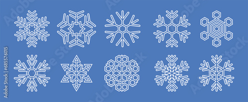 White snowflakes vector set on blue background.