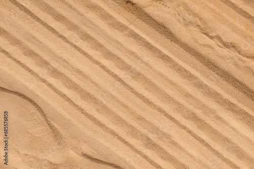 Construction medium sand background with tire track texture on surface