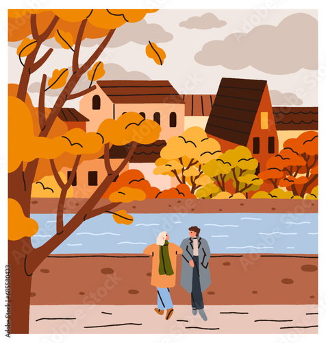 Love couple in autumn park. Romantic date at river in September. Man and woma...