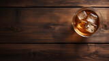 Glass of whiskey and barrel on wooden background, top view. Space for textr