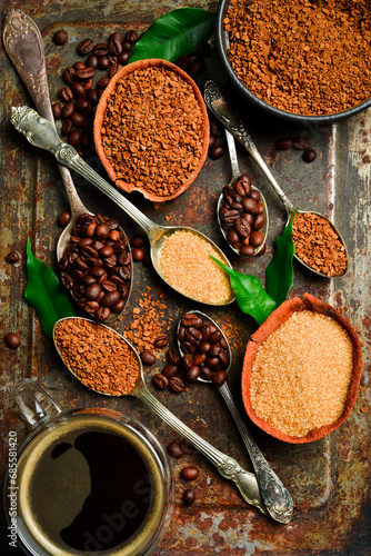 Coffee background. Assortment of instant and brewed coffee beans. On a metallic rusty background. photo