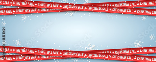 Red crossed ribbons with paper snowflakes on blue background for big Christmas sale. Festive business banner design. Vector illustration.
