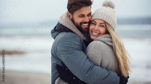 Happy couple hugging on winter beach © Sasint