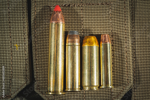 Close up photo, magnum class cartridges for revolvers and pistols, 45-70, 44 magnum, 50AE, 357 magnum.