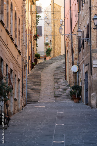 Massa Marittima, Italy - Sept 11, 2022: Steep and narrow street in old town of Massa Marittima, Italy