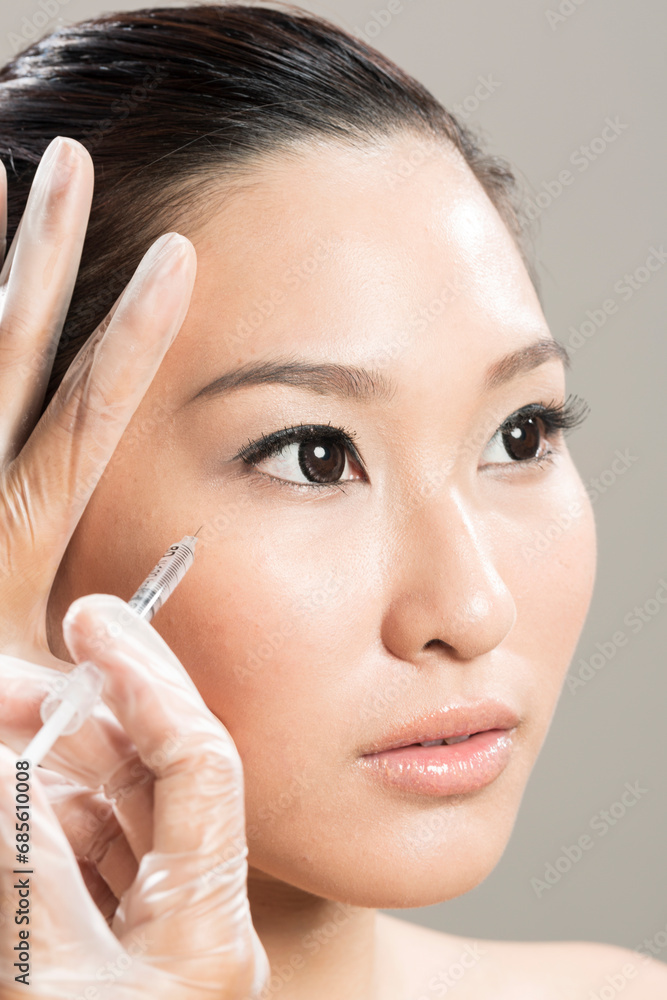 Chinese woman receiving a botox injection.