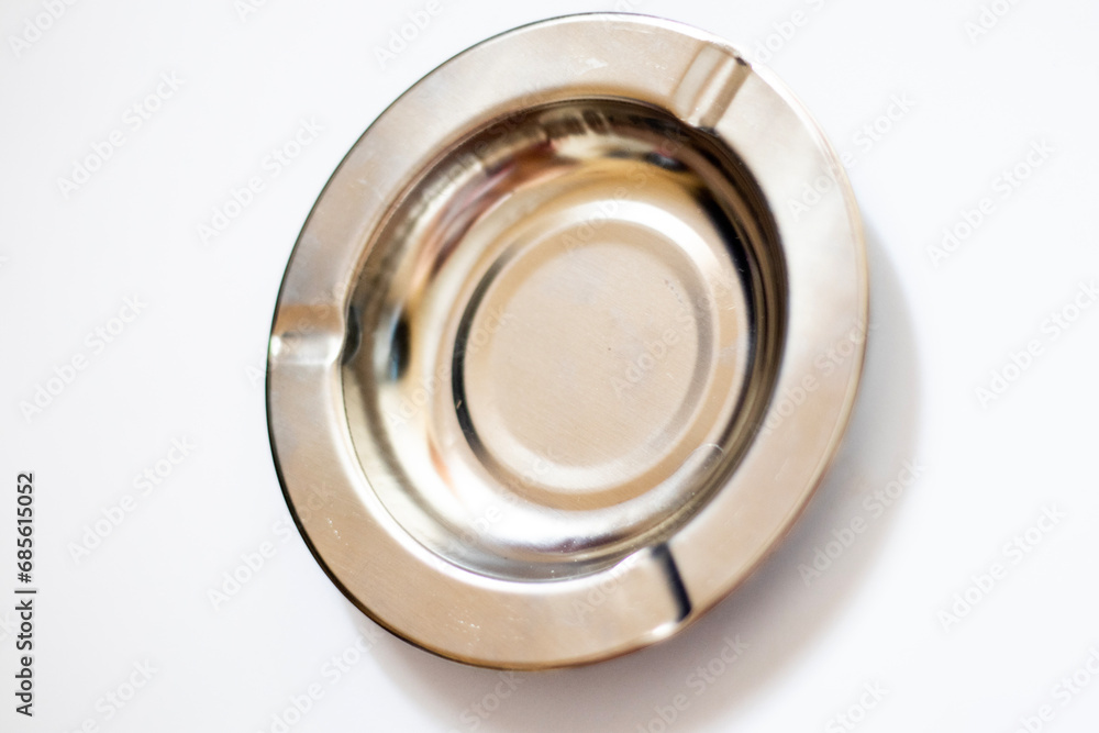 Metal silver ashtray from top view isolated on white background Metal silver ashtray from top view isolated on white background