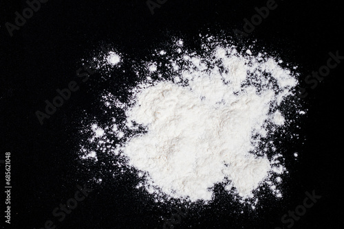 flour on a black background photo
