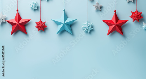 Beautiful light blue Christmas background with red blue and white stars. New Year's composition with decorations for Happy New Year.