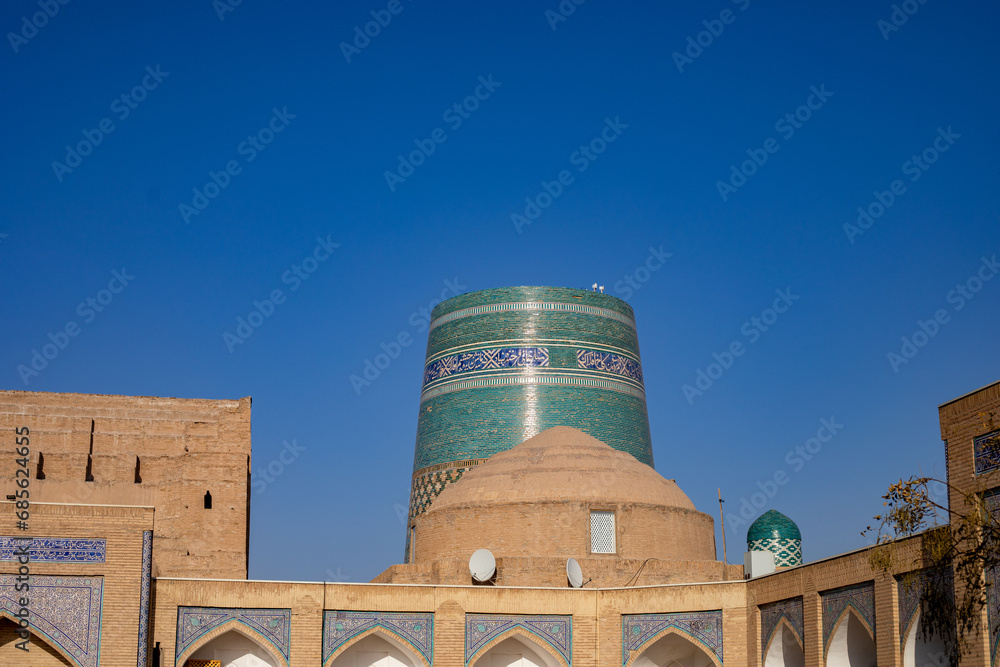 a beautiful historical place with the multiple different huge tall buildings, Khiva, the Khoresm agricultural oasis, Citadel.