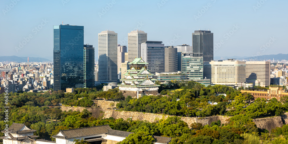 Fototapeta premium Osaka Castle from above skyline with skyscraper panorama in Japan