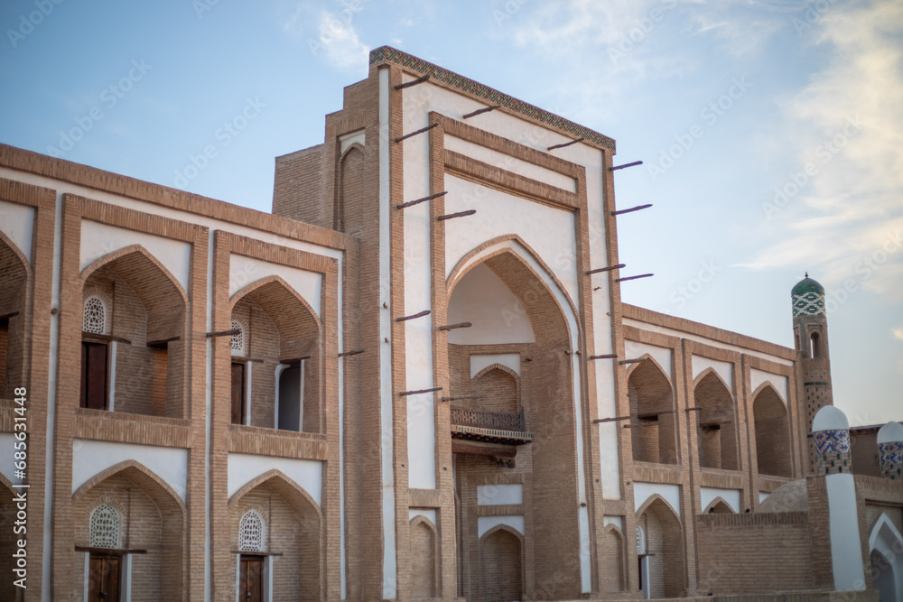 beautiful historical building with a white and clay bricks stones, Khiva, the Khoresm agricultural oasis, Citadel.