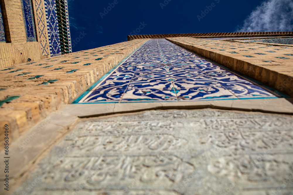 Obraz premium reflection of sunlight from the beautiful tiles in the Fortress wall, Khiva, the Khoresm agricultural oasis, Citadel.