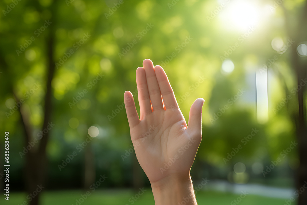 Hand of woman and green bokeh background with sunlight. Generated AI Hand of woman and green bokeh background with sunlight. Generated AI