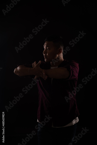 Young asian man dancing to music © dmitriisimakov