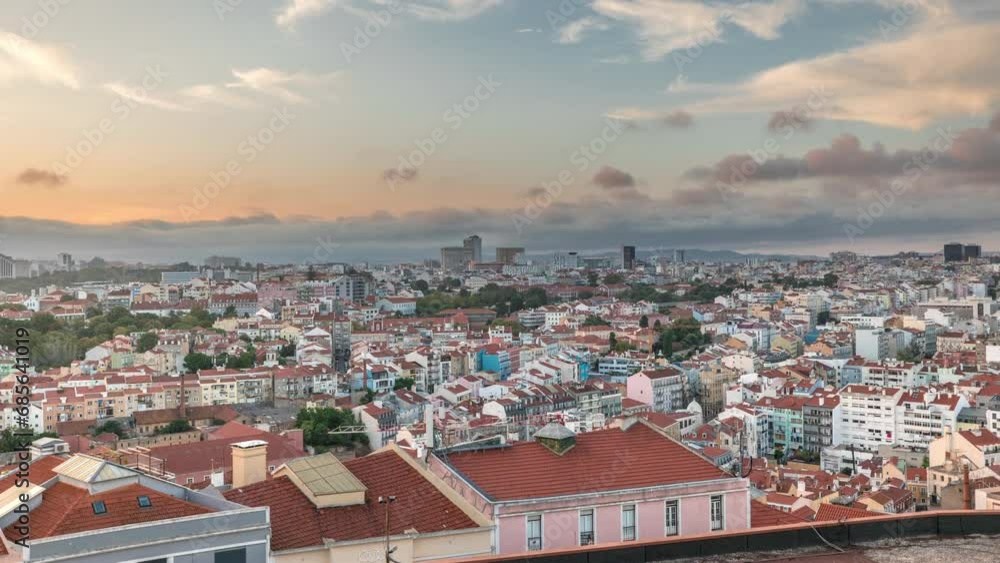 Panorama showing Lisbon famous aerial view from Miradouro da Senhora do Monte tourist viewpoint of Alfama and Mauraria old city district timelapse, red roofs at sunset. Dramatic sky. Lisbon, Portugal Panorama showing Lisbon famous aerial view from Miradouro da Senhora do Monte tourist viewpoint of Alfama and Mauraria old city district timelapse, red roofs at sunset. Dramatic sky. Lisbon, Portugal
