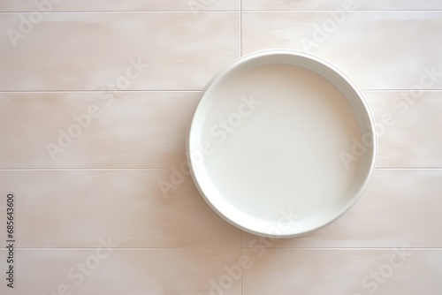 An empty white plate dish on a ceramic surface, generated by AI.