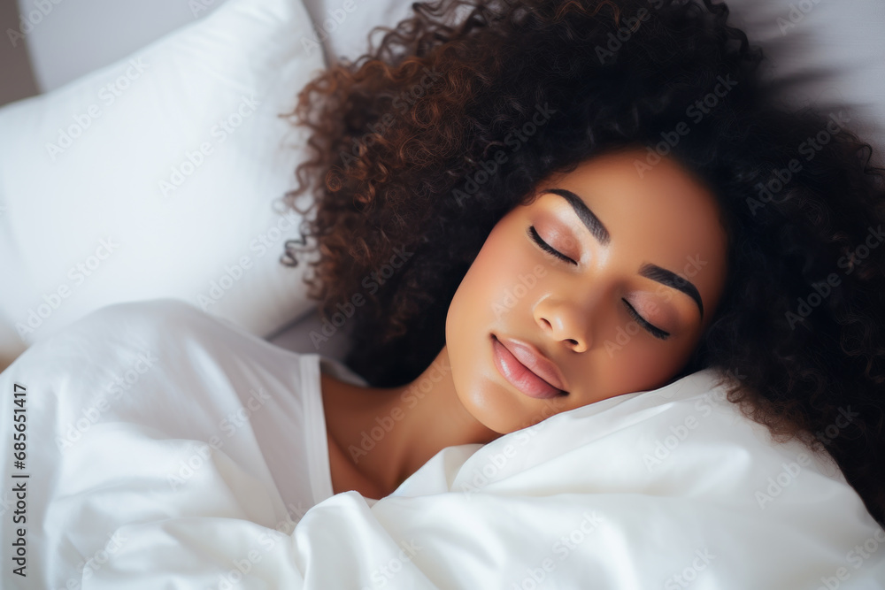 African woman sleeping well on white pillow in bed African woman sleeping well on white pillow in bed