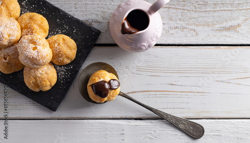 Принти на полотні Delicious profiteroles filled with cream