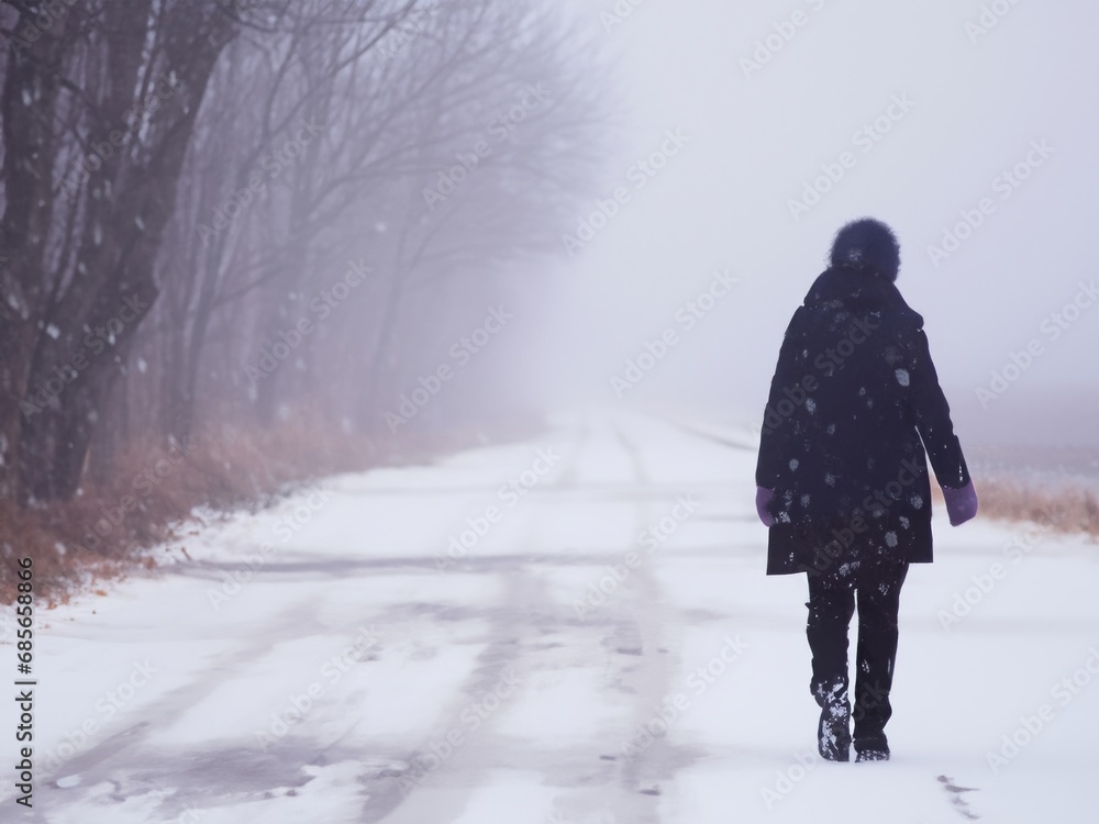 person walking in the snow, dirty snow on the road person walking in the snow, dirty snow on the road