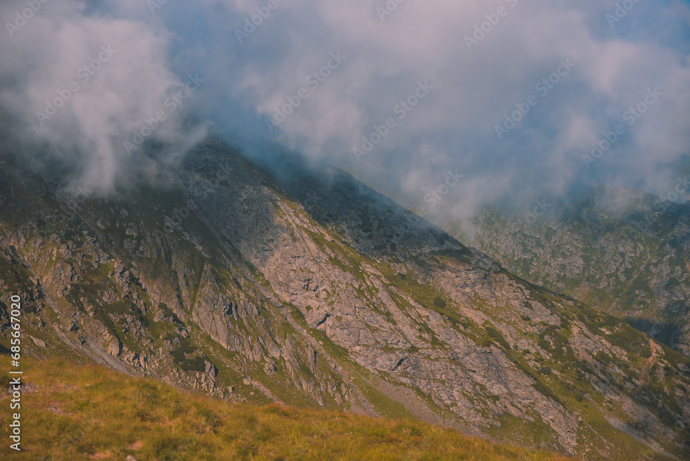 Amazing landscape in Fagaras mountains with spectacular white clouds and blue sky in Romania Amazing landscape in Fagaras mountains with spectacular white clouds and blue sky in Romania