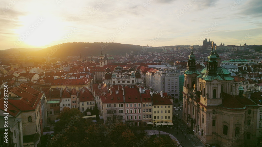 Aerial View Old Town Square in the historic heart of Prague, the capital of the Czech Republic. Showcasing the splendor of renowned Gothic landmarks. Drone footage. Sunset view