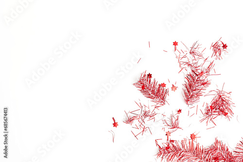 flatlay of christmas party with red streamers on white background, top view
