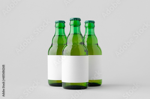 Green steinie beer bottle mockup with blank label.