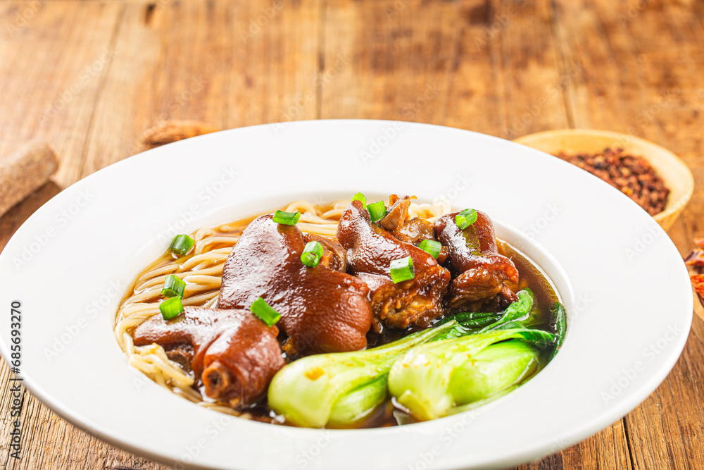 A bowl of pork knuckle noodles A bowl of pork knuckle noodles