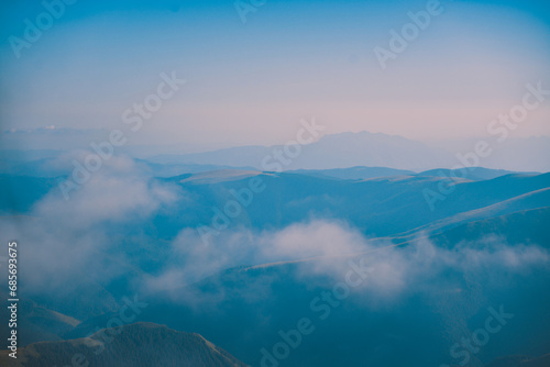 Sharp mountain peaks seen in stunning light from high altitude. Fairy tale landscape with wild Carpathians © badescu