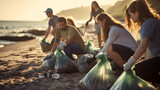 Group of friendly people picking up trash on the beach