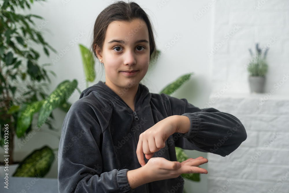 Beautiful smiling deaf girl using sign language. Beautiful smiling deaf girl using sign language.