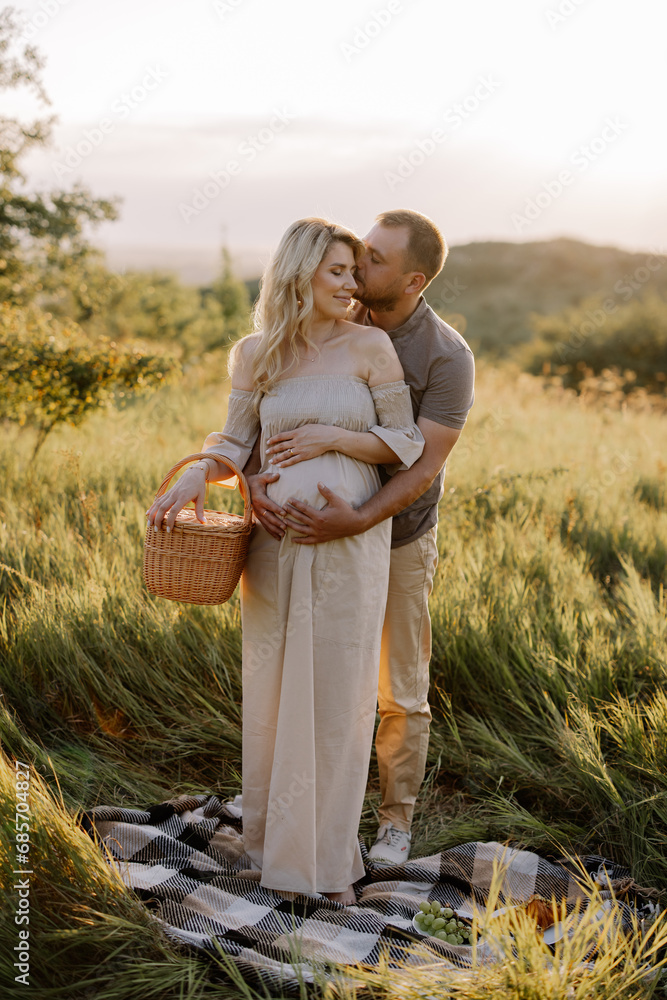 custom made wallpaper toronto digitalBeautiful young pregnant couple spending time together in outdoor at sunset. The concept of expecting a baby, parenthood.