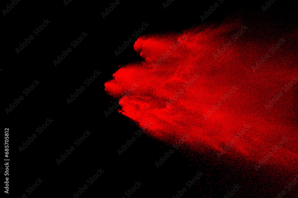 red powder explosion on black background. Colored cloud. Color dust explode. Paint Holi red powder explosion on black background. Colored cloud. Color dust explode. Paint Holi