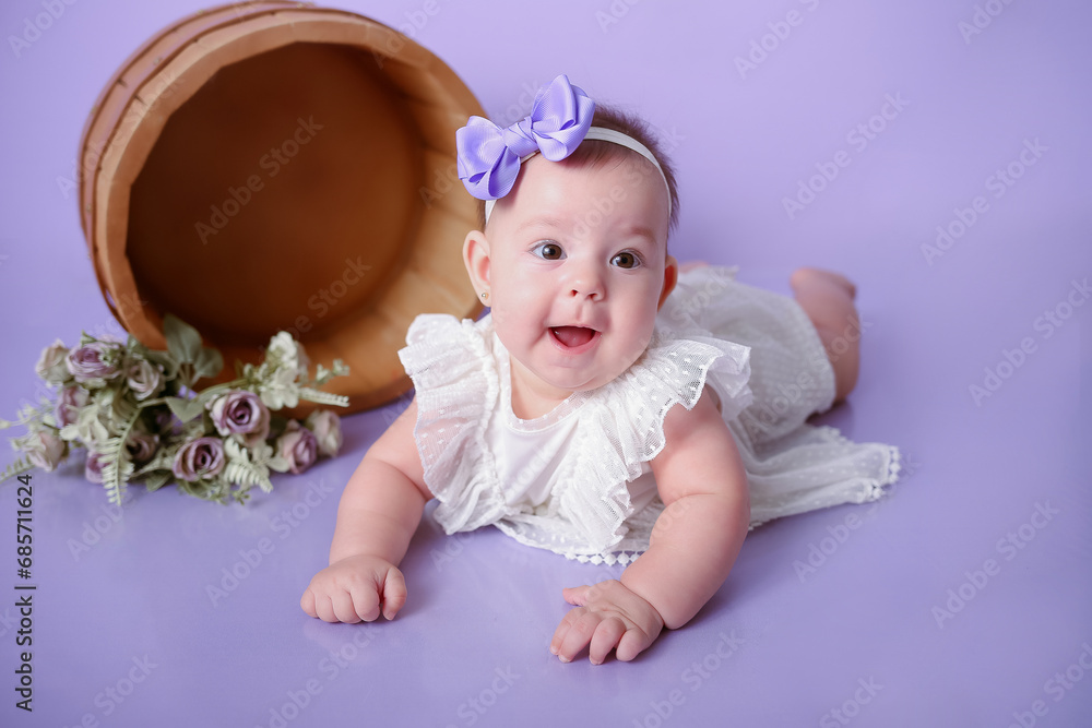 baby girl posing and smiling purple background baby girl posing and smiling purple background