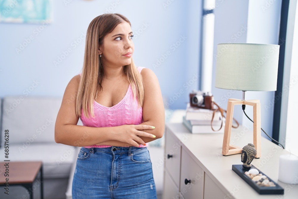Young beautiful hispanic woman standing with arms crossed gesture at home Young beautiful hispanic woman standing with arms crossed gesture at home