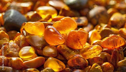 pebbles of natural baltic amber close up amber abstract background photo