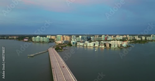 Wallpaper Mural John Ringling Causeway leading from downtown to St. Armands Key in Sarasota city, Florida. Waterfront office high-rise buildings and car traffic on bridge Torontodigital.ca
